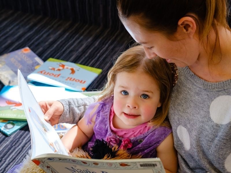 mum and toddler reading