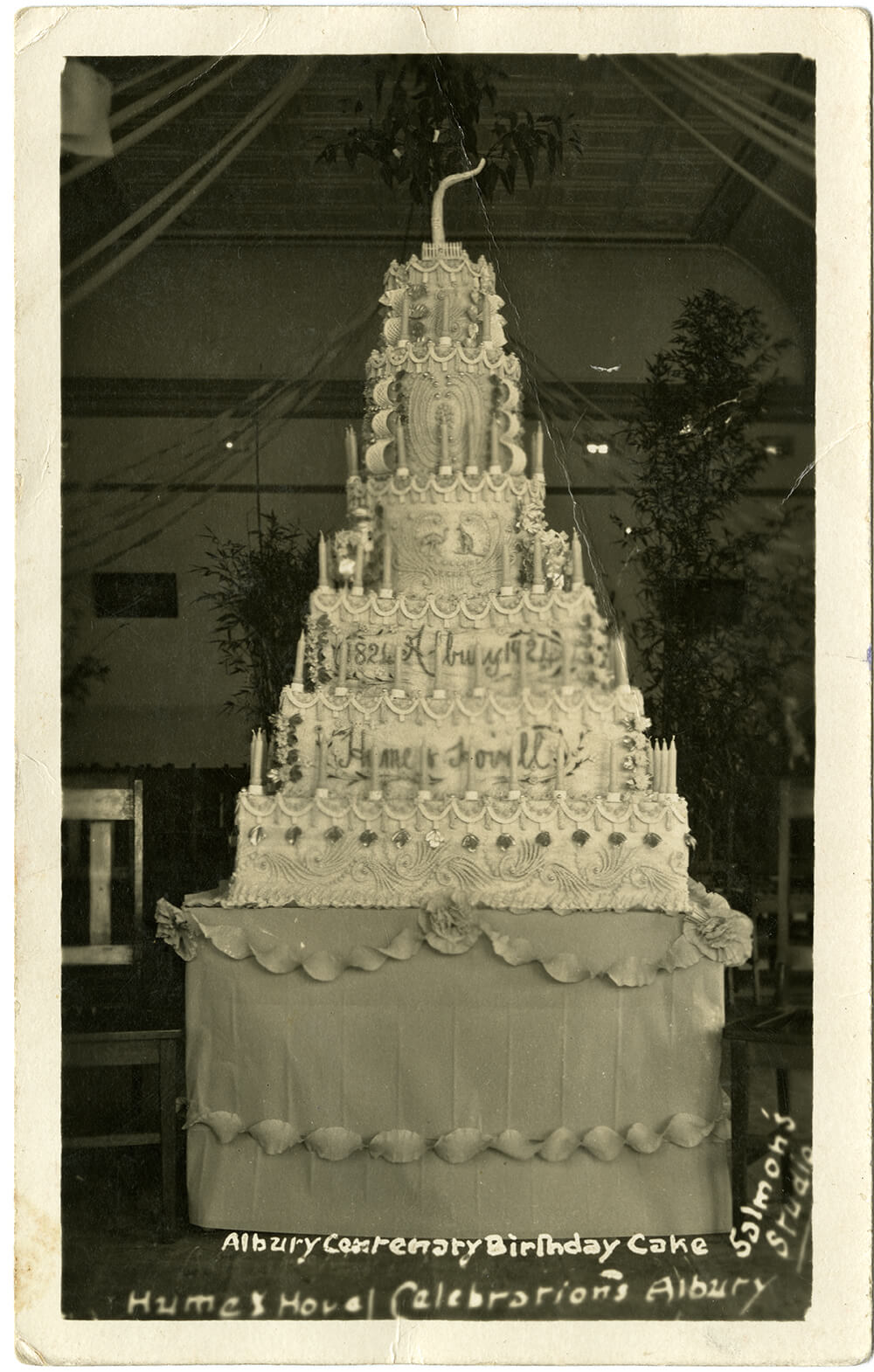 Six tiered, elaborately decorated cake celebrating Albury's centennary and the Hume and Hovell celebrations, 1924. ARM 84.015