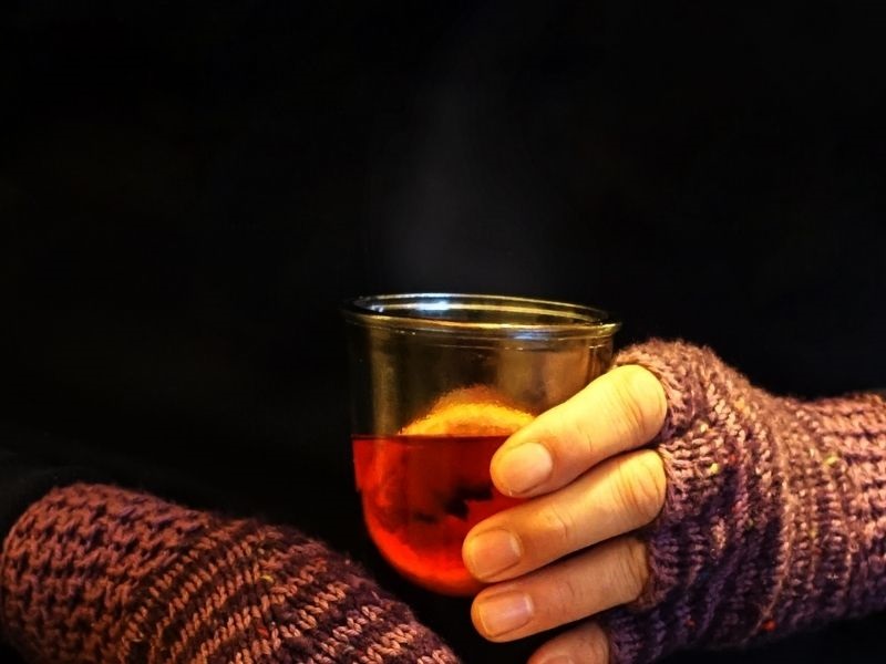 hands holding mulled wine