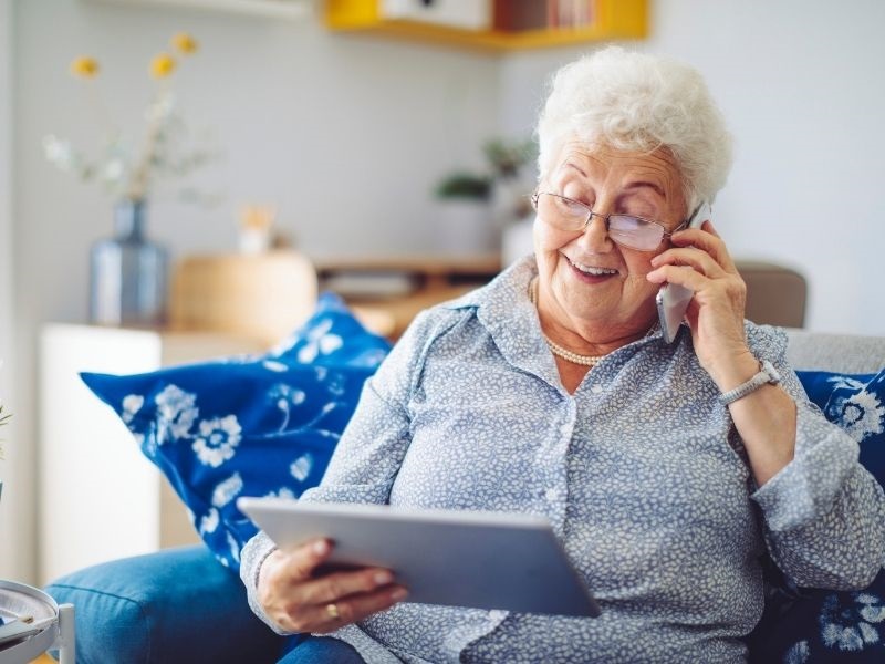 lady on phone with ipad