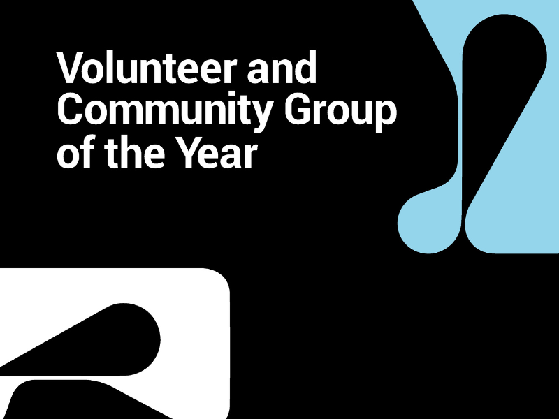 Volunteer and Community Group of the Year white and blue logo on black background