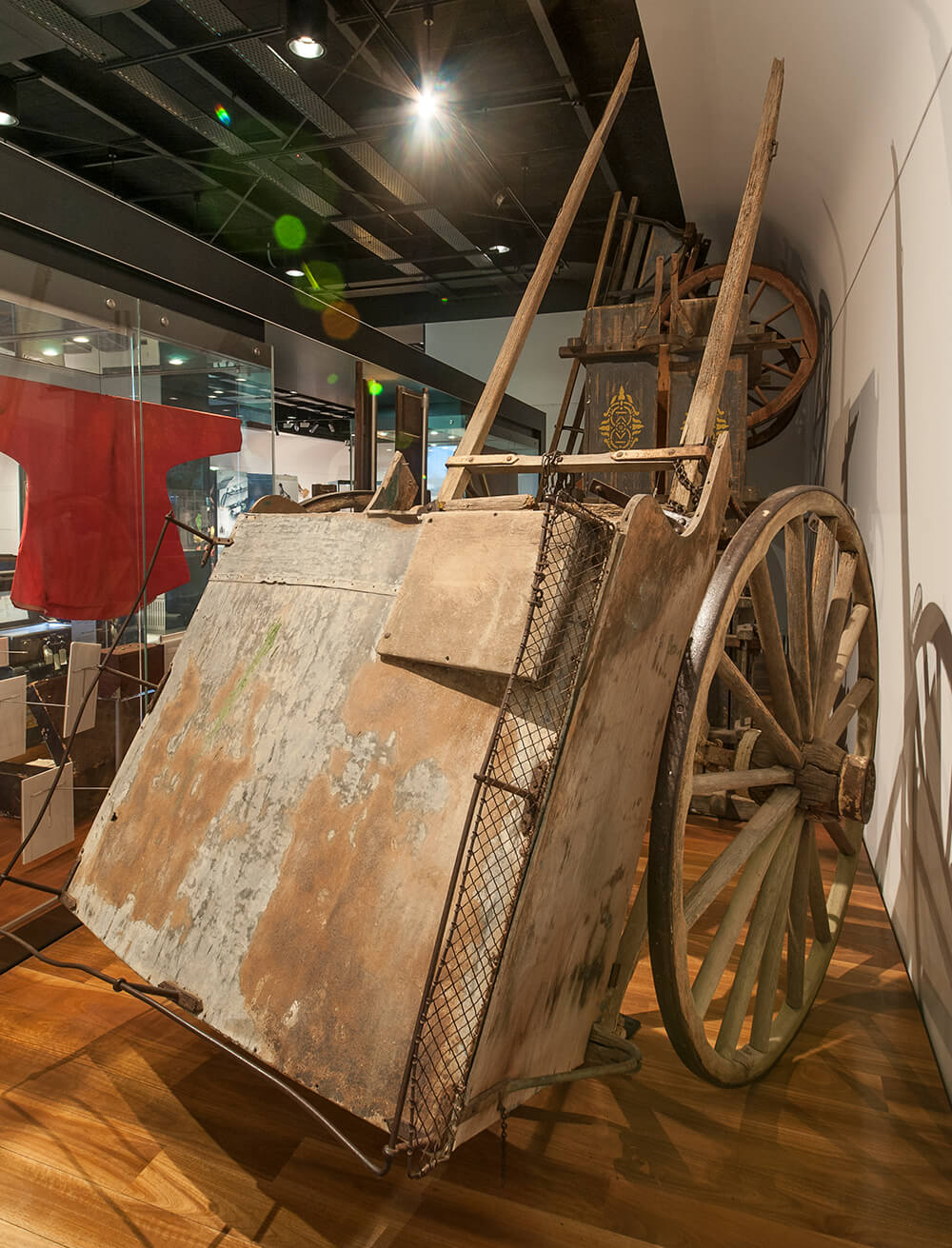 Two wheel horse drawn bakers cart from the Federal Bakery, Howlong. Drawn by a single horse the wooden cart has a storage area for holding bread that was delivered within and around Howlong, 1910. ARM 90.077