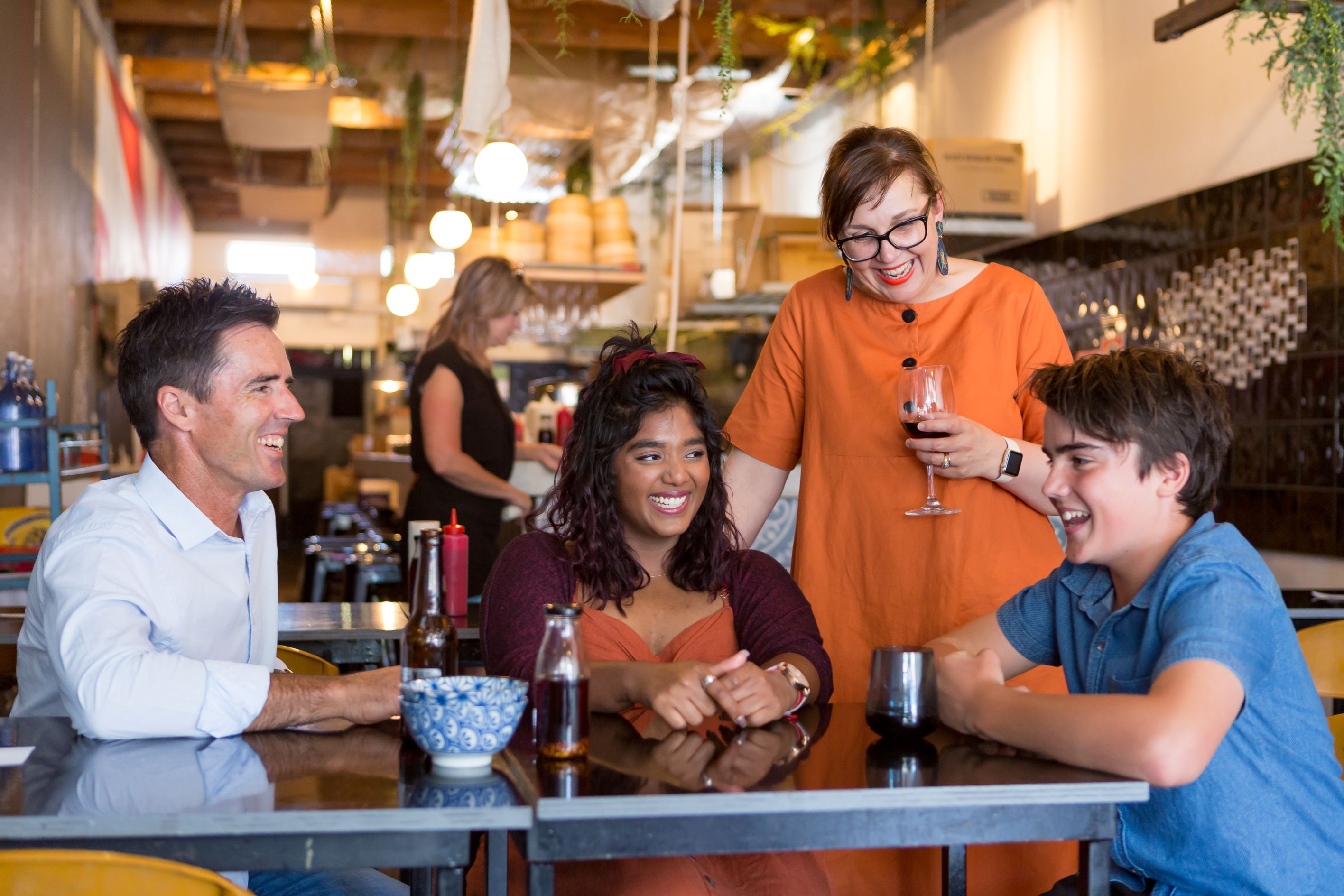 A group of people smiling together at Hapi restaurant